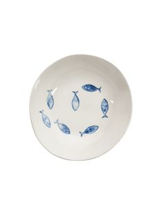 a white bowl with blue fish on it