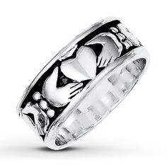 a silver ring with hearts on it