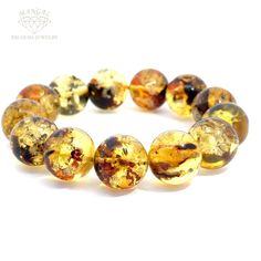 This exquisite amber bead bracelet showcases the natural beauty of polished amber stones. Each bead is unique, featuring a mesmerizing blend of golden hues and intricate inclusions that capture the essence of nature's artistry. Perfect for adding a touch of elegance to any outfit. Amber Beads, Amber Stone, Baltic Amber, Round Beads, Amber, Beaded Bracelets, Beads, Gemstones, Craft Supplies