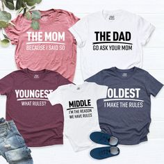 "Matching Family Shirts. Rules The Dad shirt - Go Ask Your Mom The Mom Shirt - Beacause I Said So Oldest Shirt - I'm the Reason We Have Rules Middle shirt - I Make The Rules Youngest Shirt - What Rules? HI! Welcome to my store, I'm delighted to see you here. My store's main goal is to provide you with premium everyday apparel with the best graphic t-shirts. I see you as a friend, not just a customer. I'm sure you'll love my designs. So, here is a brief description for you to-see-the order-proces Family Matching Crew Neck Cotton Tops, Family Matching Cotton Short Sleeve Tops, Cotton Relaxed Fit T-shirt For Family Matching, Family Matching Short Sleeve Pre-shrunk T-shirt, Family Matching Pre-shrunk Short Sleeve T-shirt, Family Matching Slogan Cotton T-shirt, Family Matching Cotton Slogan T-shirt, Basic Short Sleeve Shirt With Funny Text, Pre-shrunk Cotton Tops For Family Matching