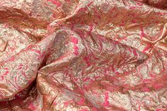 This brocade has a medium weight and a stiff drape. It is an organza burnout brocade fused to a full metallic brocade on the other face. Fitted Silk Fabric For Party, Elegant Brocade Fabric For Party, Fitted Gold Jacquard Fabric, Gold Fitted Brocade Fabric, Festive Jacquard Fabric For Party, Festive Party Jacquard Fabric, Gold Silk Fabric For Party, Gold Brocade Fabric For Party, Festive Fitted Brocade Fabric