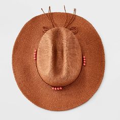 Take on sunny days with a touch of style with this Two-Tone Straw Western Hat from Universal Thread™. Designed with an indented crown, this on-trend western hat features a solid hue with a decorative beaded accent to complement your ensemble. Crafted from lightweight paper straw for all-day comfortable wear, it features an adjustable design to help you find the right fit. Plus, the 3.5-inch brim keeps your face shaded from the sun's rays. Universal Thread™: Found exclusively at Target. Casual Beaded Fedora Sun Hat, Western Beaded Hats For Spring, Beaded Brimmed Fedora For Beach, Summer Beach Fedora With Beaded Details, Casual Beaded Straw Hat For Spring, Summer Brown Beaded Hat, Wide Brim Beaded Sun Hat For Rodeo, Beaded Wide Brim Sun Hat For Rodeo, Beaded Sun Hat For Summer Rodeo