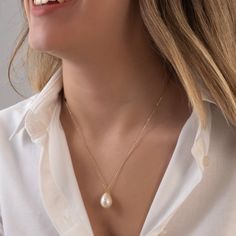 This bold pearl necklace is made of real freshwater pearl and 18k solid real gold. You can buy only pendant or pendant with chain. Please choose from options list.  There is a single real pearl pendant on the necklace. Pearl shape is teardrop. Chain style is cable chain and 1 mm (0.03 inch) thickness. Lenght of chain: 50 cm (19,6 inch) Dimensions of pearl: H: 22 mm (0,86 inch) W: 10 mm (0,39 inch) Our pearls has got smooth surface. Shape and dimensions can be slightly different because it's natu Akoya Pearl Teardrop Necklaces With Pearl Chain, Teardrop Akoya Pearl Chain Necklaces, Teardrop Akoya Pearl Necklaces With Pearl Chain, Yellow Gold Briolette Pearl Drop Necklace, Classic Necklace With Teardrop Pearl Charm, Classic Teardrop Pearl Chain Necklace, Classic Teardrop Necklace With Pearl Charm, Classic Teardrop Baroque Pearl Necklace, Teardrop Akoya Pearl Necklace With Pendant