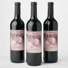 three bottles of wine sitting next to each other