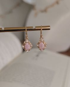 DAINTY PINK STONE GOLD EARRINGS  DETAILS  *Handmade in my small boutique studio  *Petite earrings, minimal but stylish  *Size of charm 1.5cm *Ear wires are gold filled *Your earrings will arrive safely packaged in a jewelry gift bag Please note - earrings are none returnable due to hygiene reasons. DELIVERY DEATAILS* *All UK orders are sent via the Royal Mail 1st Class Signed for service. *All international orders are sent via a Tracked and Signed service where possible. SHOP MORE STYLES: Honeya Victorian Gold Earrings, Earrings Cottagecore, Cottagecore Earrings, Boutique Studio, Dainty Gold Earrings, Art Nouveau Earring, Petite Earrings, Earrings Minimal, Earrings Art