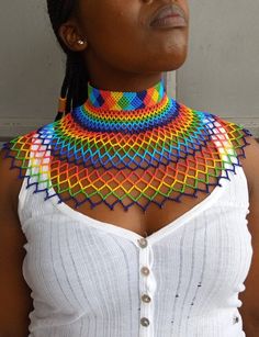 African Beaded wedding necklace, Zulu Cape necklace, Beaded shawl necklace, Christmas gift for her, Women jewelry, Bridesmaid giftThis beaded bib necklace is superbly crafted which can be worn with any outfit at different occasions and it will absolutely makes you stand out.Main color -multi color /rainbow.The necklace can be available in different colors.Wholesale available at a fair price,please contact me.For any clarification,please send me a convo or an e-mail.Thank you for visiting and hap Handmade Multicolor Bridal Necklace With Round Beads, Wedding Multicolor Beaded Chain Beads, Multicolor Beaded Chain Necklace For Wedding, Multicolor Beaded Necklace For Wedding, Multicolor Beaded Choker For Wedding, Multicolor Handmade Choker For Wedding, Bohemian Multicolor Beaded Necklaces For Wedding, Bohemian Multicolor Beaded Necklace For Wedding, Multicolor Round Beads Bridal Necklace As Gift