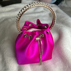 A Beautiful Hot Pink Jimmy Choo Bag That Will Always Be A Classic! I Love This Bag But I Can’t Justify Keeping It Right Now. It’s New In Box, With The Original Wrapping And The Certificate Of Authenticity. The Bag Has Never Been Used, And The Silk Satin And Crystals Are In Perfect Condition. Please Message Me If You Have Any Questions! Pink Jimmy Choo Purse, Jimmychoo Bag, Pink Jimmy Choo, Jimmy Choo Clutch, Jimmy Choo Gold, Studded Clutch, Metallic Clutch, Embellished Clutch, Leather Clutch Purse