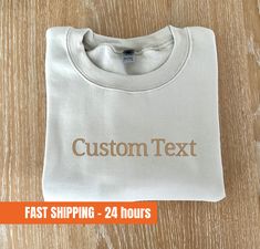 "Custom Embroidered Sweatshirt, a personalized and stylish option for your wardrobe. This Custom Text Sweatshirt is a versatile piece that can be customized to your liking. It's the perfect Personalized Crewneck Sweatshirt that also makes a great Couples Matching Sweatshirt. Whether you're treating yourself or searching for a thoughtful gift for her, this custom embroidered sweatshirt is sure to impress. Our Customized Embroidery Gift allows you to add your own text, making it a one-of-a-kind piece. Choose between a 5-inch or 10-inch text length to suit your preference and design vision. To make your custom sweatshirt even more special, we offer a range of font styles and thread colors. Take a look at the photos to see the available options and select the perfect combination for your desir Long Sleeve Sweatshirt With Embroidered Logo, Custom Text Crew Neck T-shirt For Fall, Custom Text White Long Sleeve T-shirt, Cotton Crew Top With Custom Text, White Long Sleeve T-shirt With Custom Text, Basic Crew Neck Sweatshirt With Embroidered Text, Custom Text Long Sleeve Sweatshirt, Customizable White Top With Custom Embroidery, Casual Sweatshirt With Custom Text