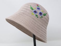 Item: women's hand embroidered flower mesh bucket hat Material: 100% polyester Size: one size fits most for women Color: beige Embroidery: needle by needle with hand Free first class shipping, 30 days return policy. Feel free to let me know if you have any question! Embroidered Sun Hat For Summer, Embroidered Summer Bucket Sun Hat, Beige Crochet Cap For Spring, Embroidered Brimmed Bucket Hat For Summer, Summer Embroidered Brimmed Bucket Hat, Spring Embroidered Sun Hat With Short Brim, Spring Cloche Hat For Vacation, Spring Vacation Cloche Cap Hat, Spring Vacation Sun Hat With Embroidery