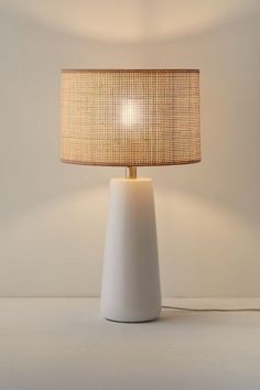 Create a serene, coastal scene in your space with this table lamp. Features a round ceramic base with a natural rattan drum shade that offers a warm feel to your lighting essentials. Equipped with a 3-way rotary switch that allows you to easily adjust the brightness to fit your needs. Plugs in to power on. Features Boho coastal table lamp Ceramic base Natural woven rattan drum shade Plug in 3-Way rotary switch Compact fluorescent compatible Requires one E26 Type A 100W 3-way bulb - not included Boho Table Lamp, Modern Lamps Bedroom, Beach Lamps, Modern Nightstand Lamps, Bedroom Lamps Nightstand, Coastal Lamp, Coastal Table, Cute Living Room, Boho Lamp