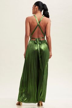 Be the day's style star in this eye-catching, moss green metallic jumpsuit. Featuring a pleated design and tie-back for a chic fit, you'll be sure to make a statement! Get ready to sparkle and shine! Pleated Fitted Jumpsuits And Rompers For Party, Chic Green Jumpsuits And Rompers For Night Out, Elegant Green Backless Jumpsuits And Rompers, Elegant Green Backless Jumpsuit, Sleeveless Pleated Party Jumpsuits And Rompers, Metallic Shimmer Jumpsuits And Rompers For Party, Green Backless Jumpsuits For Party, Green Backless Jumpsuits And Rompers For Party, Spring Green Jumpsuit With Tie Back