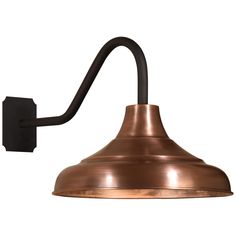 an old fashioned wall light with a metal shade on the side and a black arm