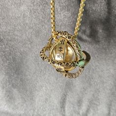 This Pendant Necklace Is Very Unique, New, And Trendy With An Astronomical Meaning. It Is Unique In The Fact That It Starts Out As A Ring You Can Wear On Your Finger And Hide All The Meaning It Holds, And Keep It To Yourself, Or Open It To It's Full Sphere Size. Very Unique Piece. It Is Made Of 316 Gauge Stainless Steel With Gold Overlay. It Is On A 23" Foxtail Chain, And The Sphere Is Just Over An Inch. As A Ring, It Is Size 9. This Piece Will Not Tarnish ( Water Not Recommended). All Of My Jew Magic Amulet Necklace, Astronomical Ring, Sphere Ring, Keep It To Yourself, Accessories Gold, Amulet Necklace, Gold Overlay, Ring Pendant, Ball Pendant