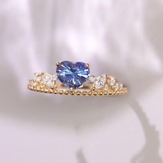 •Condition: Brand new•Center Stone: Natura Blue Sapphire from Sri Lanka, Heart cut, 1.21CT•Side Stone: Natural white diamond, round cut (VS1 clarity and F color)•Ring Weight: 2.69g (depend on the ring size)•Metal Purity: Optional Each piece is made-to-order with care and special attention to detail. all items are made with conflict-free diamonds and gems.Size: made to orderThe item will be gift wrapped and shipped.---------------------------------------------------------Available in :14k Rose or Blue Sapphire Promise Ring In 14k Gold, Blue Sapphire Ring In 14k Gold For Promise, Blue Cubic Zirconia Diamond Ring With Prong Setting, Blue Birthstone Ring With Accent Stones And Lab-created Sapphire, Blue Tanzanite Birthstone Ring, Fine Jewelry Blue Sapphire Ring Birthstone, Blue Sapphire Ring Birthstone Fine Jewelry, Fine Jewelry Blue Sapphire Birthstone Ring, Blue Sapphire Diamond Birthstone Ring