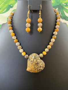 You will receive a gorgeous, genuine, yellow crazy lace agate, puffy, tilted, heart pendant and beaded necklace with matching earrings. This necklace is strung entirely with yellow crazy lace agate beads that pull out all of the colors in the heart.   Lace agate has many naturally beautiful markings, and variations.  Other than yellow, there are mostly gold and gray inclusions with a bit of black which naturally forms some patterns.  This pendant is truly stunning!   I am cuckoo in general, but Acrylic Nails Almond Shape, Heart Pendants, Pendant Heart, Almond Shape, Nails Almond, Agate Jewelry, Agate Necklace, Crazy Lace Agate, Agate Pendant