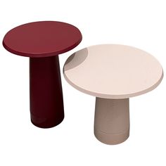 two small tables sitting next to each other on top of a white table with red tops