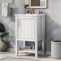 a bathroom with a sink, mirror and towel rack on the wall next to it