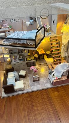 a doll house is shown with furniture and accessories in the living room, dining area and bedroom