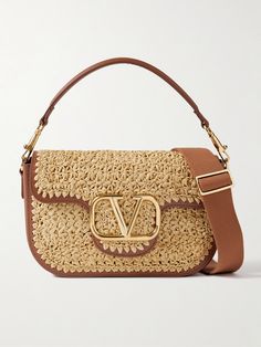 Valentino Garavani's 'Alltime' bag is woven from faux raffia and traced with leather for subtle structure. It has a short top handle and webbing shoulder strap, both of which feature gold-tone hardware that matches the large logo plaque on the front. There's plenty of space inside for your phone, cardholder and sunglasses. Designer Beige Crochet Shopping Bag, Luxury Leather Crochet Bag, Luxury Leather Crochet Bag With Leather Handles, Luxury Crochet Leather Bag With Leather Handles, Designer Beige Crochet Tote Bag, Designer Beige Crochet Bag For Travel, Designer Straw Bag With Gold-tone Hardware, Designer Woven Straw Travel Bag, Luxury Rectangular Straw Bag With Detachable Strap