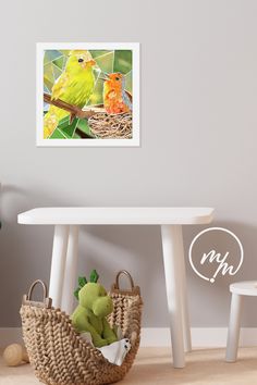 a yellow bird sitting on top of a white table next to a basket filled with stuffed animals