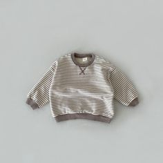 This lovely sweatshirt is an ideal choice for your little ones to wear during the pleasant spring and autumn seasons. It features a relaxed and casual style, with regular sleeves and a charming striped pattern crafted from soft and breathable cotton material. The neck and head area are thoughtfully designed without any pullcords, and the collar is a comfortable O-neck style. This piece is suitable for both boys and girls and is available in true-to-size measurements, ensuring a perfect fit for y Striped Long Sleeve Sweater For Loungewear, Cute Striped Long Sleeve Sweater, Cute Cotton Everyday Sweatshirt, Cute Everyday Cotton Sweatshirt, Cute Cotton Sweatshirt For Everyday, Striped Cotton Crew Neck Sweater, Striped Sweatshirt For Loungewear In Fall, Striped Cotton Sweater For Loungewear, Striped Sweatshirt For Fall Loungewear