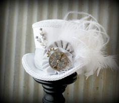 The White Rabbit in Pewter Mini Top Hat, Alice in Wonderland Mini Top Hat, Tea Party Hat, Steampunk Hat, Gear Hat, Mad Hatter Hat, Bridal www.tablescapesbydesign.com https://www.facebook.com/pages/Tablescapes-By-Design/129811416695 Christmas Tea Party, Steampunk Christmas, Tea Hats, Snowflake Wedding, Mad Hatter Hat, Mad Hatter Party