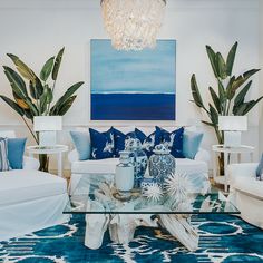 a living room with blue and white decor