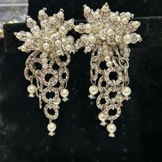 These Are Absolutely Draw-Dropping Statement Bridal Earrings!! These Were Part Of A Custom Line We Carried And Now We Are Selling Our Samples. These Are Clip On Comfy Earrings So They Will Sit Properly (No Drooping Or Pulling). Look Amazing For A Strapless Or Understated Dress. Look Super In Photos. Very Unique. White Pearls And Sparkly Crystals. The Top Part Has Dimension In Sought Of A Pearl Spray Design And The Bottom Is A Mix Of Crystal Circles With More Pearls. Approx 3” Length Faux Pearls Statement Bridal Earrings, Sparkly Crystals, Bridal Statement Earrings, Bridal Earrings, Pearl White, Clip On, And Now, Clip On Earrings, Faux Pearl