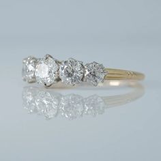 three stone diamond ring in yellow gold