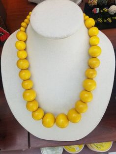 This thick necklace is made of fine multilayer beads wound together. It is very comfortable to wear and stays put around the neck. The beads are very bright and beautiful. Contact owner for any personalization. Thanks for vising my shop and come again. Stay safe https://www.etsy.com/shop/naistumityujewelry Yellow Wooden Beads For Jewelry Making, Bohemian Yellow Single Strand Beaded Necklace, Yellow Bohemian Single Strand Beaded Necklace, Yellow Single Strand Beads For Jewelry Making, Traditional Yellow Necklaces With Wooden Beads, Traditional Yellow Necklaces With Oval Beads, Yellow Necklace With Colorful Oval Beads, Yellow Jewelry With Large Oval Beads, Thick Necklace