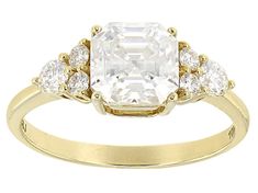 an 18k yellow gold ring set with three diamonds