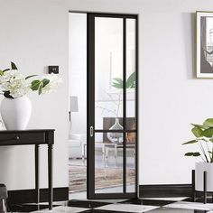 a black and white checkered floor with vases on the end table next to it