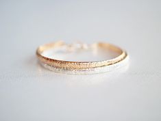 Our Blossom Floral Bangle is a wonderful staple bracelet.  The etched floral and foliage pattern makes for gorgeous texture and understated beauty that is eye catching and classic.  Hammered, burnished and finished with a pretty hook clasp for easy and secure wear Available in 14k gold filled or sterling silver metal, both non plated and nickel free (yay!)  HOW TO FIND YOUR FIT  - The best way to determine your fit is to measure the circumference of your wrist right above where the two forearm b Forearm Bones, Layered Bangles, Botanical Jewelry, Stacked Bangles, Gold Floral, Jewelry Designs, Flower Pattern, Metal Jewelry, Bangle Bracelet