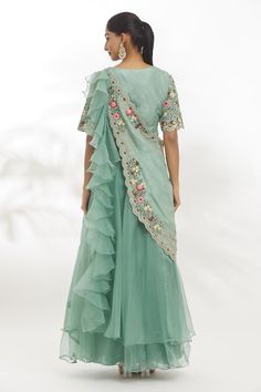 Powder green organza dola padded blouse with multi-colored resham flowers, zardosi and aari embroidery. Comes with an organza lehenga and a detachable drape. - Aza Fashions Floral Embroidered Pre-draped Saree For Reception And Festivals, Green Tissue Silk Sets With Floral Embroidery, Anarkali Style Pre-draped Organza Saree For Eid, Embroidered Green Organza Pre-draped Saree, Green Floral Embroidered Tissue Silk Sets, Green Floral Embroidery Tissue Silk Sets, Pista Green Choli With Floral Embroidery For Party, Green Pre-draped Saree With Floral Embroidery, Festive Green Pre-draped Saree With Floral Embroidery