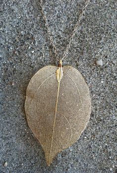 "The perfect BOHO Chic! This natural leaf pendant has been dipped in gold and hangs beautifully from a 30\" long 14K gold fill chain with gold fill spring clasp. The pendant measures 50x75mm and is a perfect long layering piece. Please let me know if you prefer a shorter length and I can make it to your specifications, free of charge. Also available in Silver, please see last photo for example of silver leaf. Each pendant is a one of a kind and shows the distinct lines and markings of each uniqu Gold Nature-inspired Necklace With Large Pendant, Gold Leaf Shaped Brass Jewelry, Gold Leaf-shaped Brass Jewelry, Gold Leaf Nature-inspired Jewelry, Nature-inspired Gold Leaf Necklace, Nature-inspired Nickel Free Gold Necklace, Gold Leaf-shaped Nature-inspired Necklace, Gold Nature-inspired Pendant Necklace, Nature-inspired Gold Pendant Necklace