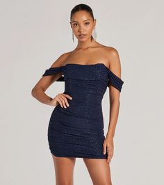 Get ready to glimmer in this gorgeous glitter knit mini dress featuring an off-the-shoulder neckline with a draped overlay and short sleeve cuffs, and a chic corset bodice for that snatched fit you love. The ruched side seams will accentuate your curves along the bodycon silhouette.Fit & FeaturesLined glitter knit fabric, plenty of stretchOff-the-shoulder angled necklineDraped overlay, short sleeve cuffsCorset bodice, flexible boningRuched side seamsMini-length bodycon fitRuns true to size Black Mini Prom Dress, Navy Blue Dresses Short, Off The Shoulder Dress Short, Snowball Dresses, Orange Homecoming Dresses, Backless Dress Short, Purple Homecoming Dress, Corset Dresses, Green Homecoming Dresses