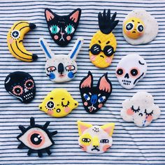 there are many different types of cookies on the table, including one with eyes and cats