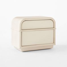 a white box with two drawers on it