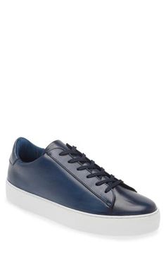 Polished leather elevates the look and feel of a streamlined sneaker that goes with everything and features a stretchy interior to keep every step secure. Lace-up style Removable insole Leather upper/synthetic lining/rubber sole Made in Portugal Blue Leather Casual Slip-on Sneakers, Sporty Navy Sneakers With Leather Sole, Casual Blue Leather Slip-on Sneakers, Modern Navy Sneakers With Round Toe, Navy Leather Sporty Sneakers, Sporty Navy Leather Sneakers, Leather Slip-on Sneakers For Sports And Athleisure, Leather Athleisure Slip-on Sneakers For Sports, Athleisure Leather Slip-on Sneakers For Sports