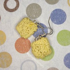 Ramen Earrings Noodles measure approximately between 1.5cm to 2.25cm Materials: ▫ Polymer Clay ▫ Hypoallergenic Hanging Earring Hook Each Ramen square is handmade by me, so you may receive a pair of earrings that are slightly different from the ones pictured in the listing. As they are all made by hand all are similar but no two pairs will ever be the same! I can also do custom orders. Please feel free to send me a message with any questions or ideas! Thanks for checking out my shop! Square Hypoallergenic Earrings For Gift, Hypoallergenic Square Earrings For Gifting, Hypoallergenic Square Earrings As Gift, Hypoallergenic Square Earrings For Gifts, Handmade Square Earrings For Gift, Handmade Yellow Rectangular Earrings, Yellow Rectangular Earrings As A Gift, Yellow Rectangular Earrings Gift, Yellow Rectangular Earrings For Gifts