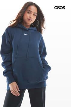 Sweatshirt by Nike Layer up Drawstring hood Long sleeves Nike logo detail Pouch pocket Oversized fit Nike Phoenix Fleece, Nike Hoodies, Blue Nike Hoodie, Spring Floral Dress, Leggings Sale, Navy Fashion, Long Black Dress, Jumpsuit Shorts Rompers, Blue Nike