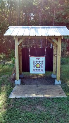 a small wooden structure with a sign on it