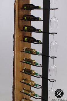 a wine rack with several bottles and glasses on it