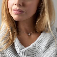 "Dainty upside down moon necklace. Perfectly balanced and totally cute. The ideal, minimal piece for everyday.  D E T A I L S: * Top quality moon charm - 3/8\" (9.5mm)  * Beautiful dainty chain * Photo shows a length of 14\" (XS neck)  M A T E R I A L S: * All sourced from USA or Italy * 100% sterling silver chain and moon charm * Comes in a cute little package ready for gifting HANDMADE WITH LOVE * All items are handmade with love in our happy Louisiana studio. * We use only highest quality, ethically sourced materials. * Committed to providing you with excellent customer service. SHIPPING UPGRADES We offer shipping upgrades should you need your order faster. They will be displayed as an option once you add an item in your cart. GIFTS & PACKAGING We want to be good to the planet, so we sh Dainty Moon-shaped Jewelry For Everyday, Minimalist Adjustable Moon Phase Necklace, Minimalist Moon Phase Pendant Necklace, Sterling Silver Moon Phase Charm Necklaces, Silver Minimalist Charm Necklace For Layering, Minimalist Moon Phase Necklace, Minimalist Jewelry With Moon Charm, Minimalist Everyday Necklaces With Moon Phase, Minimalist Half Moon Clavicle Chain Necklace