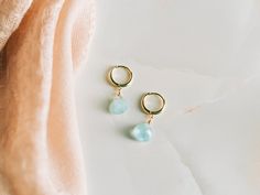 These genuine blue aquamarine hoop earrings would make a perfect gift. Comes in a gold-pressed foil jewelry box and is ready to be gifted.  Aquamarine is the birthstone for the month of March. -------------------------------------- ALL AQUAMARINE JEWELRY  https://etsy.me/3DCL16F AQUAMARINE EARRINGS https://etsy.me/30IhyKf BIRTHSTONE EARRINGS https://etsy.me/3x5L5JE ------------- MATERIAL Genuine 8mm Aquamarine -------------------------- PROCESSING TIME 1 Business Day ------------------------ EAR WIRE OPTIONS: Gold Vermeil Sterling Silver Click Shop to See More Semi-precious Stones Available: Garnet (January) Amethyst (February) Aquamarine (March) Clear Quartz (April) Emerald (May) Moonstone (June) Ruby (July) Peridot (August) Sapphire (September) Rose Quartz (October) Citrine (November) To Gemstone Hoop Jewelry Gift, Gemstone Hoop Jewelry For Gifts, Blue Small Hoop Earrings With Matching Set, Fine Jewelry Teardrop Hoop Earrings As Gift, Teardrop Aquamarine Jewelry For Anniversary, Gold Aquamarine Round Jewelry, Blue Dainty Hoop Jewelry, Elegant Turquoise Huggie Earrings Gift, Round Aquamarine Gold Jewelry