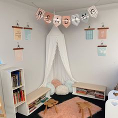 a child's bedroom decorated in pink and white