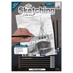 a drawing book with pencils and an image of a boat