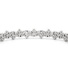 An absolute showstopper, this diamond tennis bracelet will have all eyes on your wrist. It features marquise diamonds and round diamonds arranged in a fanciful pattern to create a row of diamonds with gently undulating arches. This tennis bracelet is lovely on its own, but lovelier when worn with bangles and dainty chains. Marquise Diamond Bracelet With Single Cut Diamonds, Formal Marquise Diamond Bracelet With Diamond Accents, Formal Marquise Diamond Bracelet With Accents, Silver Marquise Diamond Cut Bracelet, Marquise Diamond Bracelets With Diamond Accents, Diamond Tennis Bracelet With Marquise Prong Setting, Classic Silver Marquise Diamond Bracelet, Marquise Diamond Cut Bracelet, Marquise Diamond Cut Diamond Bracelet