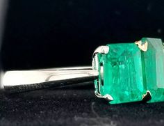 GORGEOUS VINTAGE PLATINUM & 18K GOLD COLOMBIAN EMERALD RING CENTER GEM EMERALD WEIGHS 2.13CARAT SIZE 9X7 mm CENTER GEM EMERALD COLOMBIA BERYL EMERALD GORGEOUS COLOMBIAN EMERALD AAA RATED!! CLEAN ,VERY NICE CUT ,AMAZING BRILLIANCE FULL OF FIRE, side set natural green emerald 2.86ct. size 8x6mm RING size 8 Tremendous old vintage ring in excellent condition Retail value $19,500 net . Appraisal available Colombian Emerald Ring, Colombian Emeralds, Three Stone Rings, Green Emerald, Old Vintage, Vintage Ring, Emerald Ring, Ring Ring, Three Stone