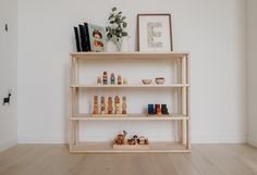 a wooden shelf filled with lots of different items